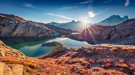 Sunny autumn scene of Lac Blanc lake with Mont Blanc (Monte Bianco) on background, Chamonix location. Astonishing morning view of Vallon de Berard Nature Preserve, Graian Alps, France, Europe. - obrazy, fototapety, plakaty