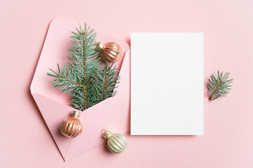Christmas holidays greeting card mockup with festive decor on pink, new year card mock up with copy space