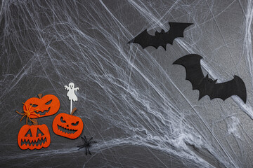 Traditional festive composition for Halloween party. Funny seasonal props, homemade autumn decor