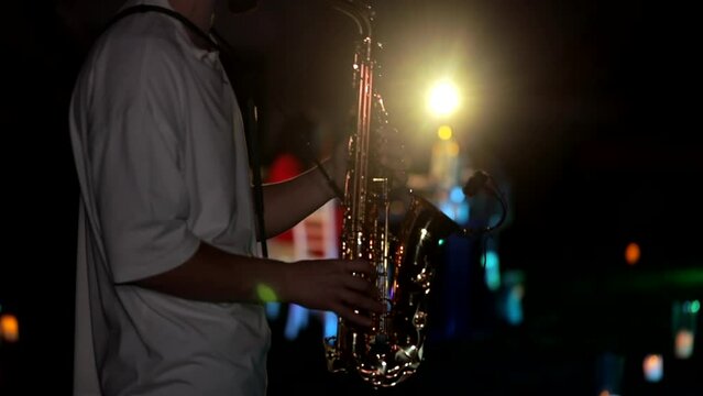 The saxophonist plays at a event