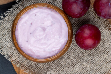 flavored pink yogurt with ripe and sweet plum