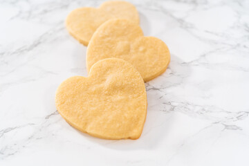Heart-shaped sugar cookies with royal icing