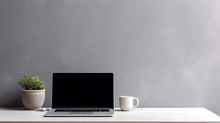 Laptop computer with blank screen on desk in modern home or office interior mock up