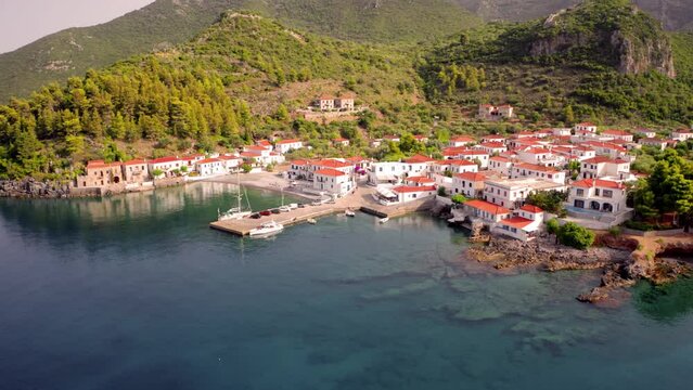 4k drone forward video (Ultra High Definition) of Paralia resort. Colorful outdoor scene of Peloponnese peninsula, Greece, Europe. Morning on Mediterranean seascape. Vacation concept background..