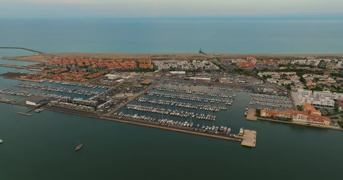 Aerial view of port leucate with mediterranean sea in background, sunset France. Port Leucate aerial view leisure boats marina vacation seaside resort France sunny day