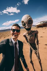 Fotobehang Man in black and alien doing a selfie in New Mexico desert with flying saucer in the background © IB Studio