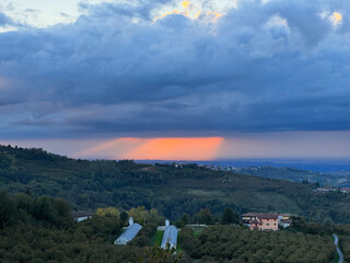 Italian landscape in Langhe and Monferrato, vineyards are visible on the hills.