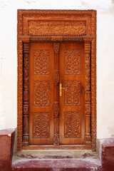 Fototapeta na wymiar traditional cultural swahili door decoration and detail of arabic and indian origin found in Tanzania and Zanzibar Island 