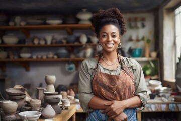 Fototapeta premium Ceramists owner working in a pottery studio. Small Business