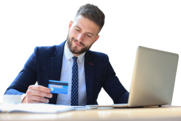 Smiling man sitting pays by credit card with his laptop on a transparent background