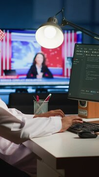 Vertical video Qualified arab programmer writing code on computer screen while in office using Java programming languages. Middle Eastern Developer working on fixing database errors while working from