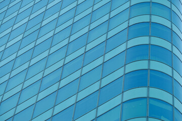 Blue glass windows of modern office building - 666591887