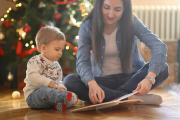 Joyful Christmas Moments: Nanny and Toddler by the Christmas Tree