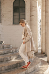 Fashion woman wearing beige coat on the street - 666595401