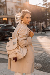 Fashion woman wearing beige coat on the street - 666596277