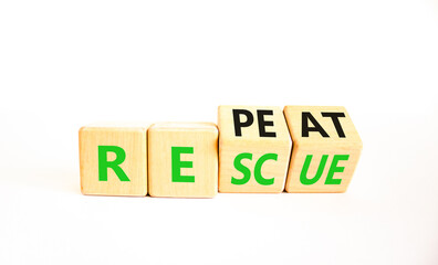 Rescue and repeat symbol. Concept words Rescue Repeat on wooden block. Beautiful white table white...