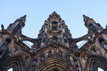 A low angle view of the Sir Walter Scott Monument in Edinburgh, Scotland. Clear blue sky Background.