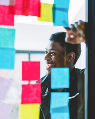  happy smiling male employee working in modern office