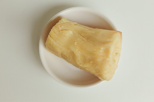 Tapai is fermentation of cassava with yeast. Indonesian snack. Isolated on white background. Flat lay or top view