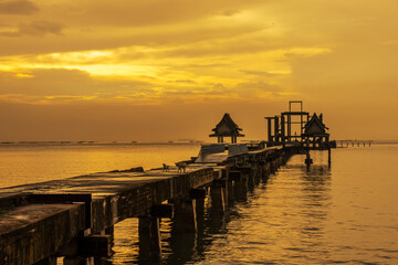 The background of the sea by the evening sea, with natural beauty (sea water, rocks, sky) and fishermen are fishing by the river bank, is a pleasure during travel.