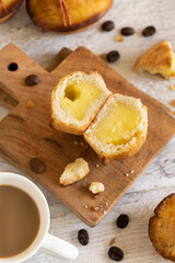 Pasticciotto leccese pastry filled with egg custard cream on a wood close up