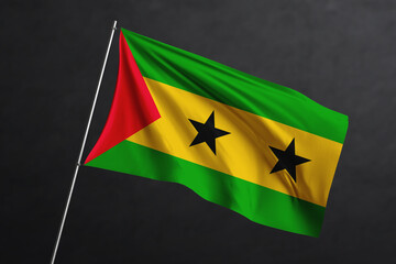 3D Waving flag design. Sao tome and Principe National flag on black background.