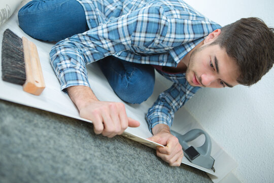 a man is fitting underlay