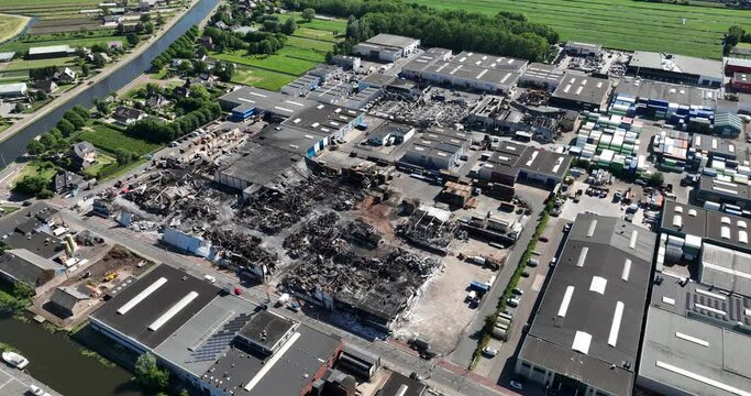 Aerial drone view of the aftermath of a large fire in Ter Aar on an industrial complex.