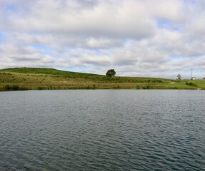 A beautiful view of the lake in the park on a sunny day.
