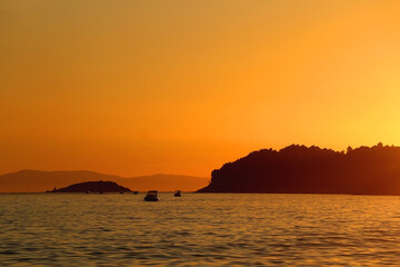 Sailing boat and beautiful sunset in Vela Luka, on island Korcula, Croatia.