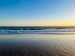 Evening quiet sea horizon, seascape background, sandy coast