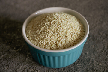 Sesame grains in a bowl, close-up, vegetarian food, healthy food