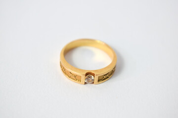Close Up Golden ring with diamond on isolated white background