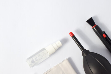 Cleaning set for camera air blower, microfiber, brush and more. Isolated on white background