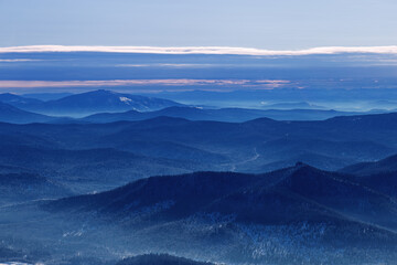 Winter nature panorama of far away blue mountains, picturesque view, aerial tonal perspective,...