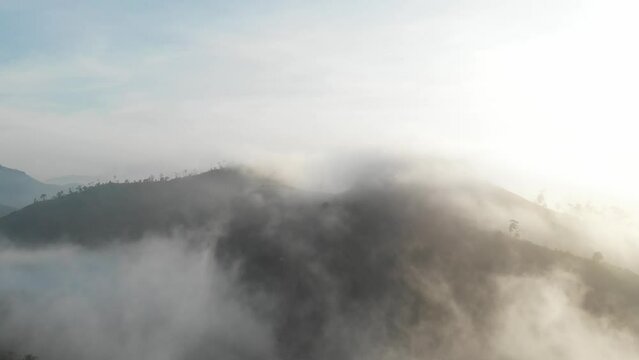 Lam Dong hills and mountains rising in the morning mist, viewed from above