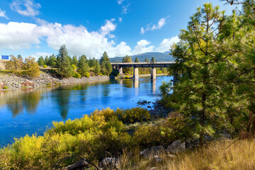 View of the Spokane River as it runs under the Centennial Trail Bridge at the border of Post Falls, Idaho and Stateline and Liberty Lake, Washington, USA.