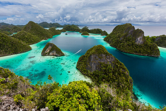 A view from on top of the small islets of the natural protected harbor in Wayag Bay, Raja Ampat