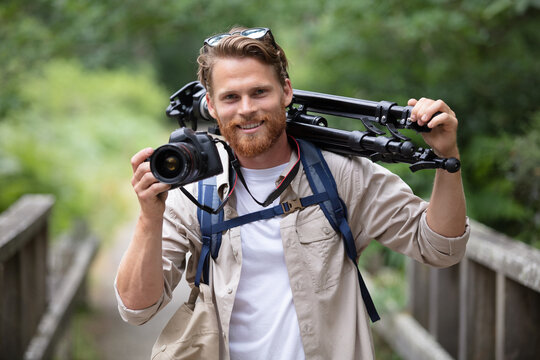 young male photographer taking a photo