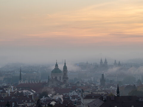 View of Prague spires and towers in morning mist from Petrin Hill, Prague, Czechia (Czech Republic)