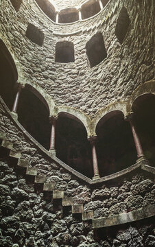 View of spiral staircases at the Initiation Well, purportedly used for ceremonial purposes by Freemasons in the 19th century, at Quinta da Regaleira, Sintra, Portugal