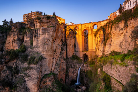 Ronda view with beautiful bridge and waterfall and traditional white village of Pueblos Blancos region, Andalusia, Spain