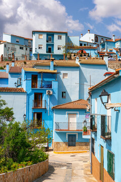 Village street in blue painted Smurf house village of Juzcar, Pueblos Blancos region, Andalusia, Spain