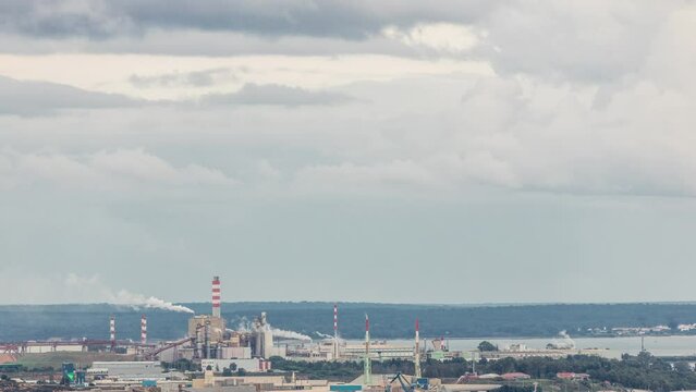 Thermoelectric Power Plant with smoking pipes aerial timelapse. Deactivated electricity power plant located near the city of Setubal, in Portugal, that used Fuel Oil. Industrial factory with port
