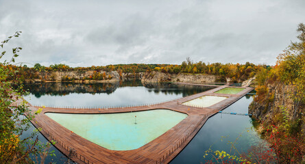 Aerial panoramic view of popular touristic location Zakrzówek Quarry, Krakow. Floating swimming pool. Cloudy autumn day