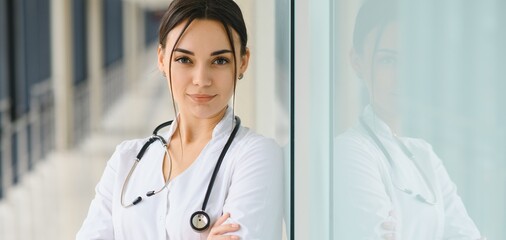 Portrait of woman doctor at hospital corridor