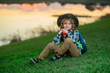 Child tourists with backpacks. Adventure, travel, and tourism concept. Kid walking with backpacks...