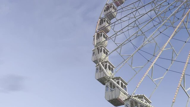 A vintage ferris wheel spinning at sunset
