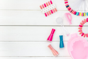 Manicure set with nail tools and palette of nail polish, top view. Beauty cosmetic products