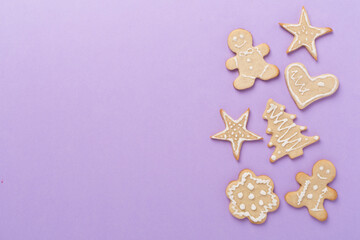 Fototapeta na wymiar Cute homemade Christmas cookies on color background,top view